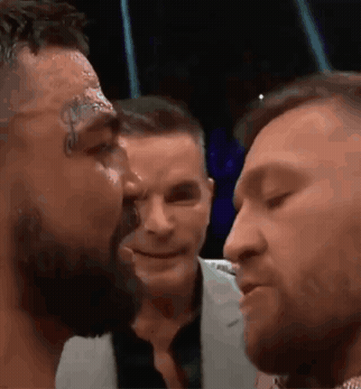 Two Men Kissing In Crowd GIF
