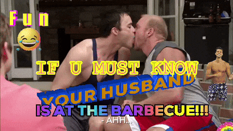 Two Men Kissing In Front Of Building GIF