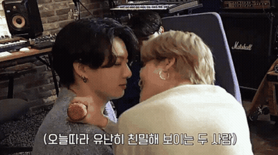 Two Men Kissing In Front Of Marshall Amplifier GIF