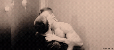 Two Men Kissing In Front Of Mirror GIF