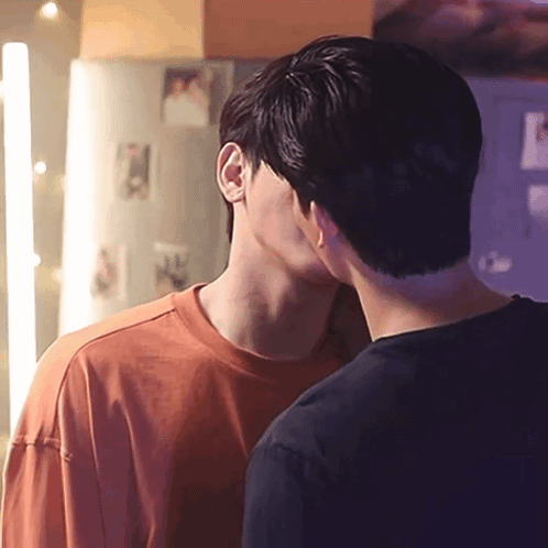 Two Men Kissing In Front Of Refrigerator GIF