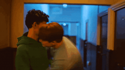 Two Men Kissing In Hallway GIF