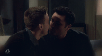 Two Men Kissing On Couch With NBC GIF