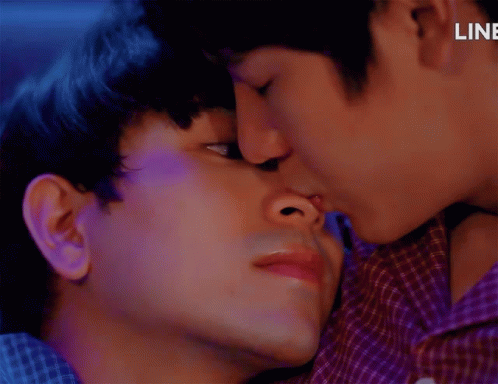Two Men Kissing With Word Line Behind Them GIF