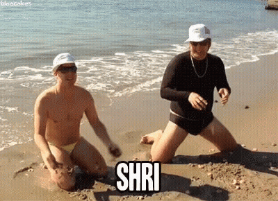Two Men Kneeling on Beach Shri