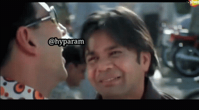 Two Men Laughing And Looking At Each Other GIF