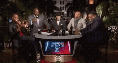 Two Men Laughing In Front Of Kia Banner GIF