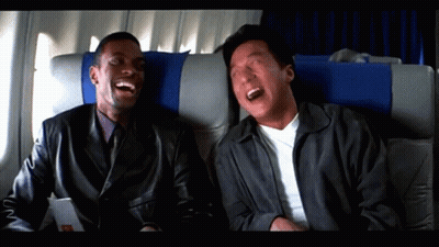 Two Men Laughing On Airplane GIF