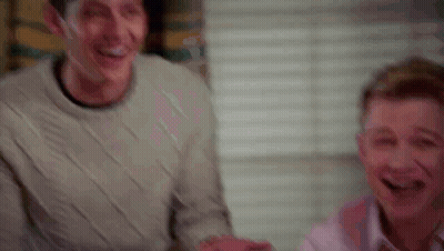 Two Men Laughing Playing Video Game GIF