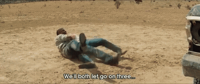 Two Men Laying On The Ground With The Words We 'Ll Both Let Go On Three GIF