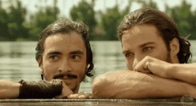 Two Men Leaning Over Water Looking At Each Other GIF