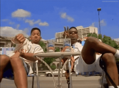 Two Men Legs Crossed Drinking Soda GIF