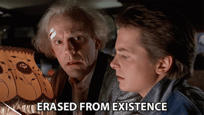 Two Men Looking At A Lamp With The Words " Erased From Existence " Above Them GIF