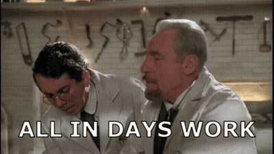 Two Men Looking At All In Days Work GIF