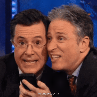 Two Men Looking At Cell Phone GIF