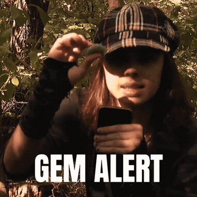 Two Men Looking At Cell Phone And Magnifying Glass GIF