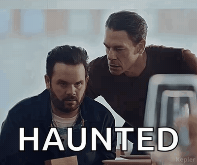 Two Men Looking At Computer Screen Saying Haunted GIF
