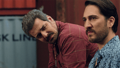 Two Men Looking At Container Saying Ck Line GIF