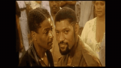 Two Men Looking At Each Other GIF