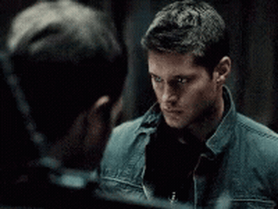 Two Men Looking At Each Other In Mirror GIF