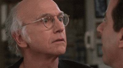 Two Men Looking At Each Other One In Pink Shirt GIF