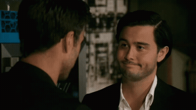 Two Men Looking At Each Other One With Beard GIF