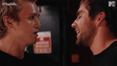 Two Men Looking At Each Other GIF