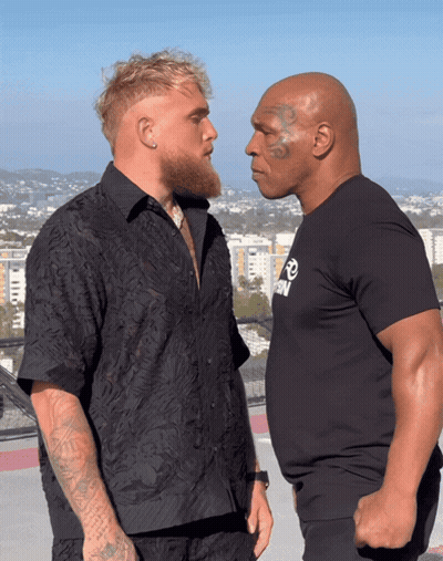 Two Men Looking At Each Other GIF