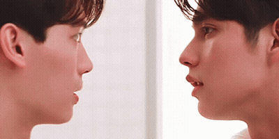 Two Men Looking At Each Other With Mouths Open GIF