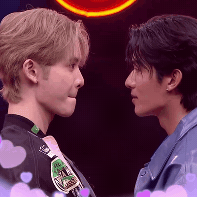 Two Men Looking At Each Other With N.I.M. Jacket GIF