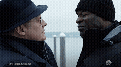 Two Men Looking At Each Other With NBC Logo GIF