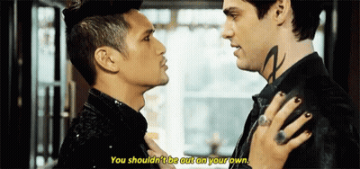 Two Men Looking At Each Other With Neck Tattoo GIF