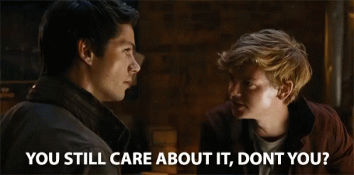 Two Men Looking At Each Other With The Words " You Still Care About It , Don 'T You ? " GIF