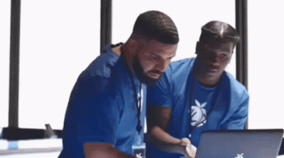 Two Men Looking at Laptop
