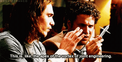 Two Men Looking At Model Airplane GIF