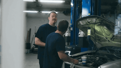 Two Men Looking Under Car Hood GIF