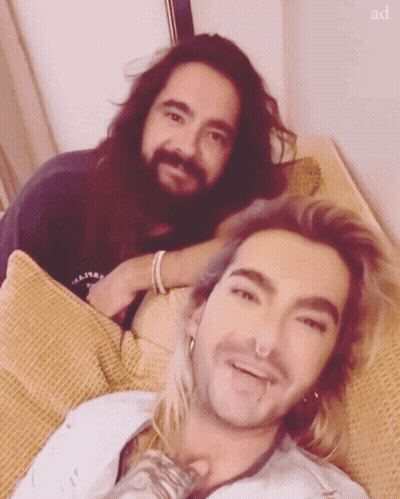 Two Men Lying On Couch GIF