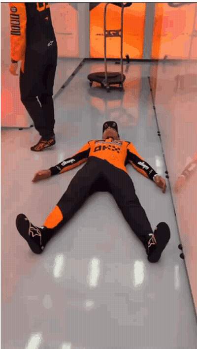 Two Men Lying On Floor With BMX Shirt GIF