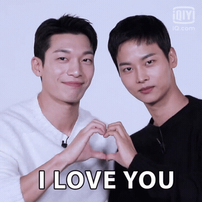 Two Men Make A Heart Shape With Their Hands And The Words I Love You GIF