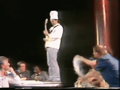 Two Men Next To Caracol Television GIF