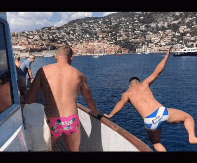 Two Men On A Boat With Buddy Miracle Swim Trunk GIF