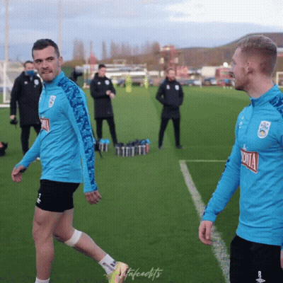 Two Men On A Soccer Field With One Wearing A Shirt That Says Sonia On It GIF