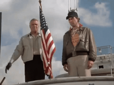 Two Men On Boat With American Flag GIF