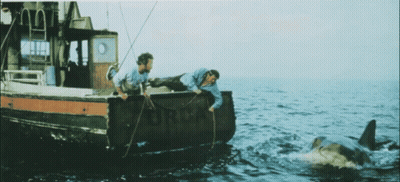 Two Men On Boat With Ford GIF