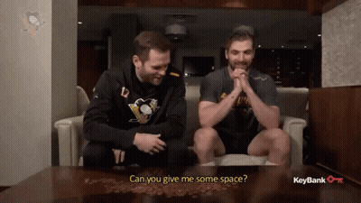 Two Men On Couch Asking For Space GIF