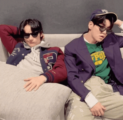 Two Men On Couch One Wearing Property Of Pol Shirt GIF