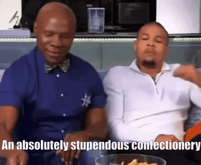 Two Men On Couch Saying Absolutely Stupendous Confectionary GIF