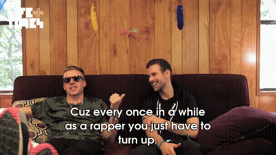 Two Men On Couch Saying Cuz Every Once In D While As A Rapper GIF