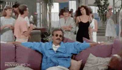 Two Men On Couch Saying What Kind Of Host GIF