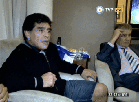 Two Men On Couch With TVP Vivo Screen GIF